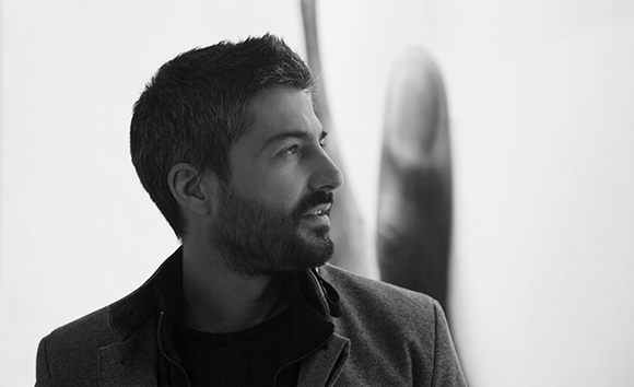 Black and white profile portrait of a man with a beard looking toward the right.
