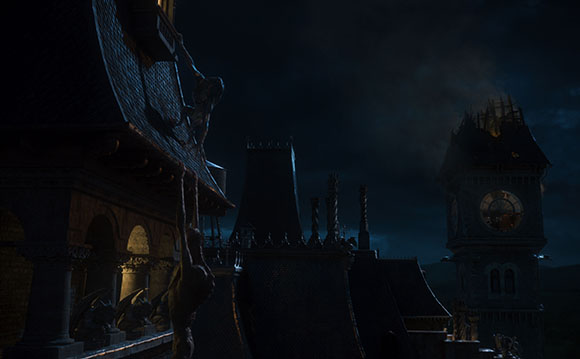 Gargoyles sit on the roof of a dark, gothic building under a night sky.
