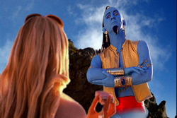 A blue-skinned character in a gold vest stands with arms crossed, looking at a blonde woman's back.