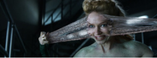A woman's face is being pulled apart by a thick, fleshy, translucent substance.
