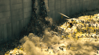 A large crowd of figures swarms against a tall concrete wall as a helicopter flies overhead in dusty light.