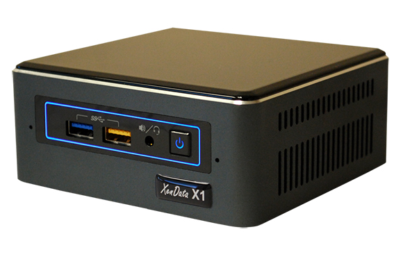 A black XenData X1 compact storage device with blue illuminated ports and a power button.