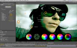 A close-up of a person in sunglasses with digital color wheels and sliders overlaid on the screen.