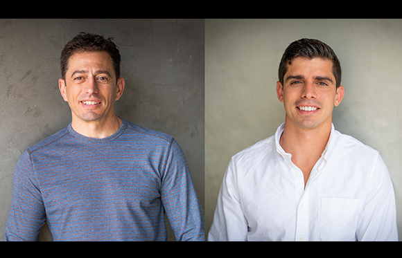 Two smiling men in headshot portraits against neutral gray backgrounds.