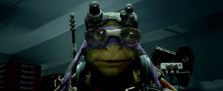A mutant turtle character wearing purple goggles and a matching headband.