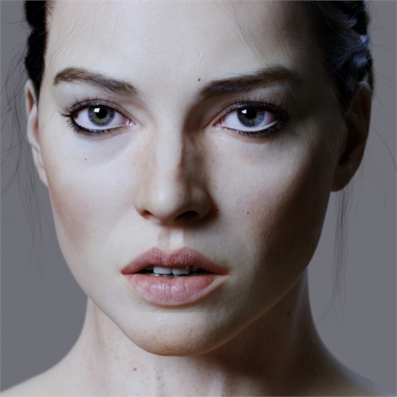 Close-up portrait of a woman with light skin, dark eyes, and dark hair looking directly forward.