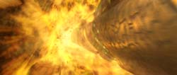 An abstract, blurred explosion of bright yellow, orange, and golden light streaks.
