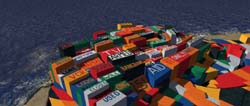 A large, disorganized pile of multicolored shipping containers sits on a sandy beach by the ocean.