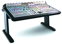A large professional audio mixing console with numerous knobs, sliders, and buttons on a black desk stand.