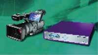 A handheld thermal camera with a screen next to a rectangular purple electronic device on a green background.