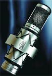 A silver condenser microphone with a black mesh grille positioned diagonally against a dark blue background.