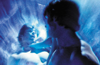 Two people in a dreamlike, blue-lit scene with soft, glowing textures.