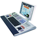 An audio mixing console with various knobs, sliders, and buttons connected to a computer monitor displaying software.
