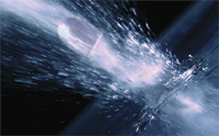 A bullet moving rapidly through water, creating a trail of bubbles and splashes.