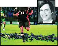 A soccer player in a dark jersey with number 11 runs on a field, overlaid with a man's portrait.