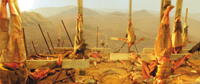 Several bodies are hung from vertical poles overlooking a vast, hilly landscape under a hazy sky.