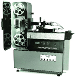 A vintage film projector with an open side panel revealing two film reels.