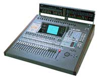 A digital audio mixing console with numerous sliders, buttons, and a central display screen.