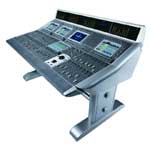 A silver electronic control console featuring several digital screens and various control buttons.