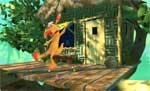 An orange cartoon character dances on a wooden platform outside a small hut surrounded by greenery.