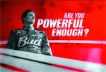Red advertisement with a man in a Bud shirt and the text 'ARE YOU POWERFUL ENOUGH?'