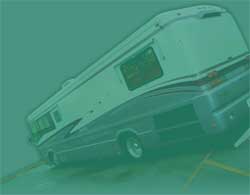 A large white and grey motorhome parked diagonally in a parking space.