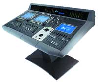 A professional digital audio mixing console with multiple screens, knobs, and faders on a stand.