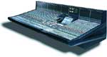 A large professional audio mixing console with numerous sliders and knobs.