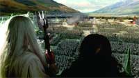 Two figures with long hair look out over a massive army gathered in a wide valley between mountains.