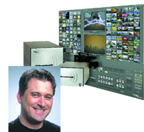 Portrait of a smiling man overlaid on electronic hardware and a large wall of video monitors.