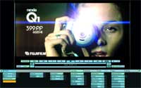A computer screen showing a Fujifilm Q1 camera advertisement featuring a person's face.