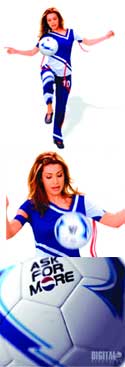 A woman in a blue and white athletic outfit juggling a soccer ball against a white background.