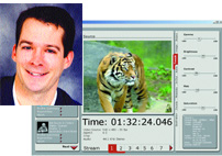 Portrait of a smiling man next to a computer screen displaying a video of a tiger and editing controls.
