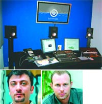 A computer workstation with monitors and speakers above two headshots of men.