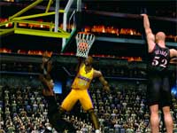 A basketball player in a yellow uniform performs a slam dunk during a game.