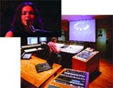A woman singing into a microphone and a person sitting at a large mixing console in a studio.