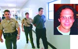 Officers walk down a bright hallway next to an inset portrait of a man with glasses.
