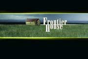 A small house sits in a grassy field under a cloudy sky with the text Frontier House.