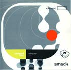 Abstract gray and white organic shapes with a bright red circle and yellow accent on a dark background.