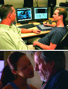 Two men sit at a desk with dual monitors while a man and woman face each other closely below.