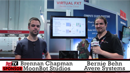 Two men stand in a convention hall in front of a display for Virtual FXT and Avere Systems.