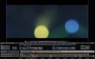Video editing software interface displaying two out-of-focus circles, one yellow and one blue, on a dark background.