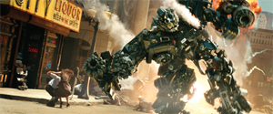 A massive mechanical robot walking through a city street past a liquor store and fleeing people.