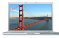 A silver laptop showing a scenic view of the Golden Gate Bridge on its screen.