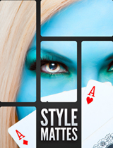 Close-up of a person with blue skin, blonde hair, and green eyeshadow holding Ace playing cards.
