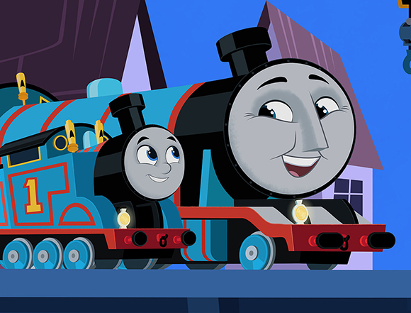 Two blue cartoon steam engines with smiling faces parked next to each other.